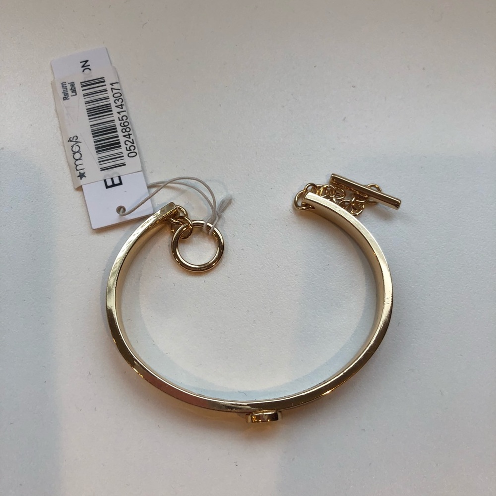 Brand new BCBG gold bracelet with S.